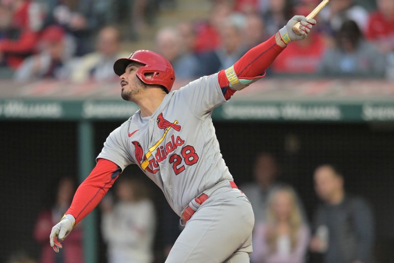 May 26, 2023; Cleveland, Ohio, USA; St. Louis Cardinals third baseman Nolan Arenado (28) hits a sacrifice fly during the sixth inning against the Cleveland Guardians at Progressive Field. Mandatory Credit: Ken Blaze-USA TODAY Sports