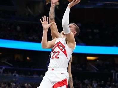 ORLANDO, FLORIDA - NOVEMBER 21: Malachi Flynn #22 of the Toronto Raptors shoots against the Orlando Magic during the second half of an NBA In-Season Tournament game at Amway Center on November 21, 2023 in Orlando, Florida. NOTE TO USER: User expressly acknowledges and agrees that, by downloading and or using this photograph, User is consenting to the terms and conditions of the Getty Images License Agreement. (Photo by Rich Storry/Getty Images)