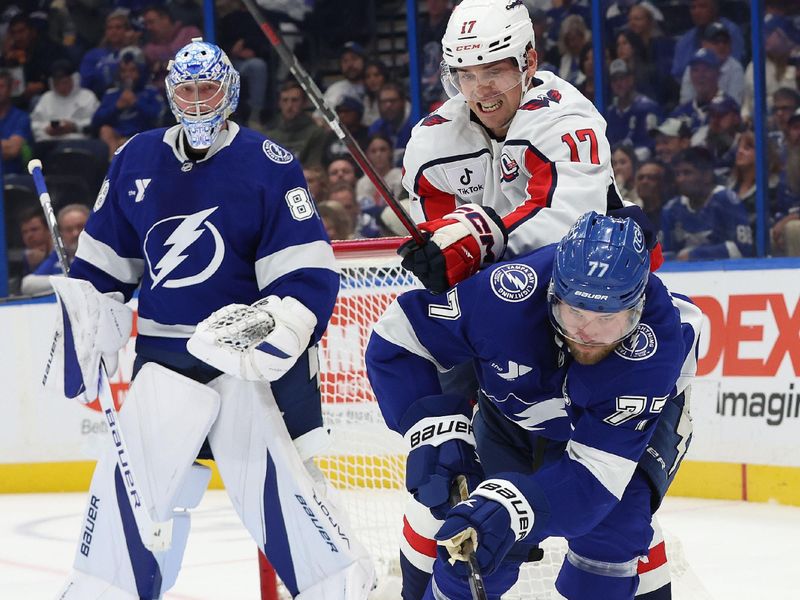 Nov 27, 2024; Tampa, Florida, USA;  Tampa Bay Lightning defenseman Victor Hedman (77) skates with the puck as 
Washington Capitals center Dylan Strome (17) defends during the second period at Amalie Arena. Mandatory Credit: Kim Klement Neitzel-Imagn Images