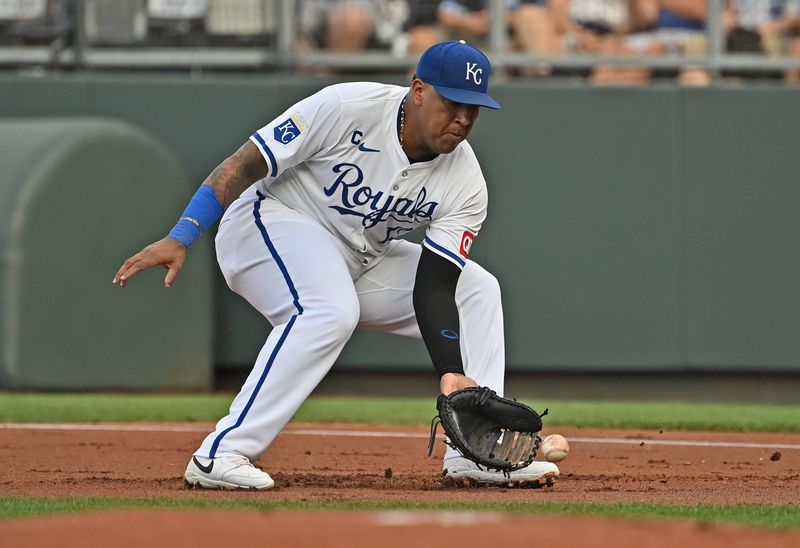 Jul 27, 2024; Kansas City, Missouri, USA;  Kansas City Royals first baseman Salvador Perez (13) fields a ground ball in the first inning against the Chicago Cubs at Kauffman Stadium. Mandatory Credit: Peter Aiken-USA TODAY Sports