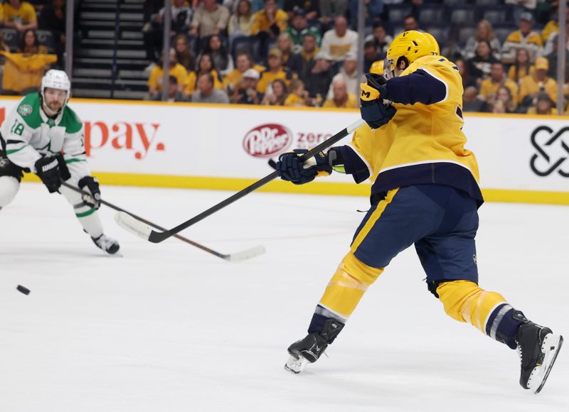 Nov 8, 2025; Nashville, Tennessee, USA; Nashville Predators right wing Luke Evangelista (77) shoots and scores during the first period against the Dallas Stars at Bridgestone Arena. Mandatory Credit: Alan Poizner-Imagn Images