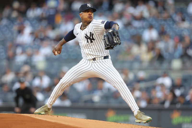 May 20, 2024; Bronx, New York, USA; New York Yankees starting pitcher Marcus Stroman (0) pitches against the Seattle Mariners during the first inning at Yankee Stadium. Mandatory Credit: Brad Penner-USA TODAY Sports