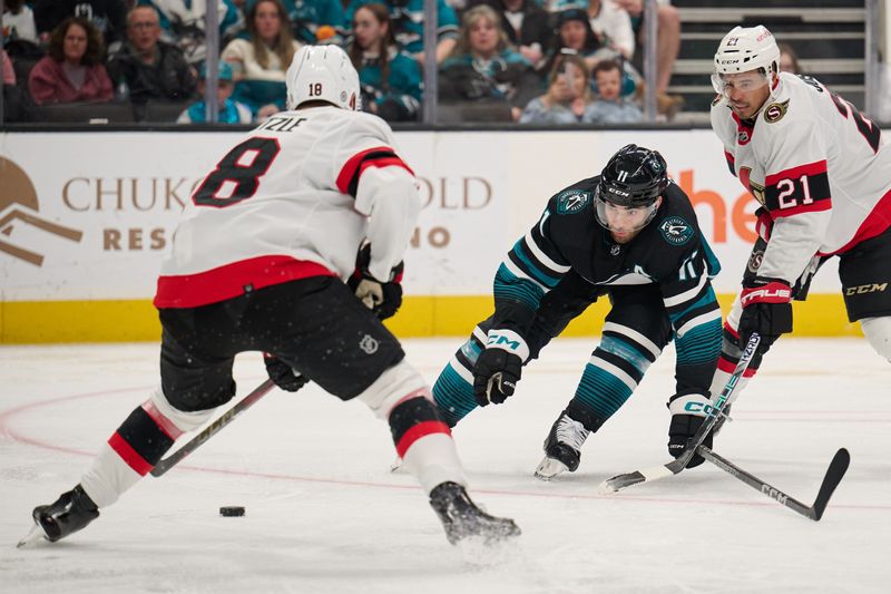 Mar 9, 2024; San Jose, California, USA; San Jose Sharks center Luke Kunin (11) forechecks against Ottawa Senators center Tim Stutzle (18) and right wing Mathieu Joseph (21) during the second period at SAP Center at San Jose. Mandatory Credit: Robert Edwards-USA TODAY Sports