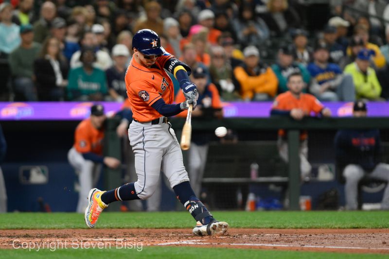 Sep 27, 2023; Seattle, Washington, USA; Houston Astros center fielder Mauricio Dubon (14) hits a 3-run home run against the Seattle Mariners during the fourth inning at T-Mobile Park. Mandatory Credit: Steven Bisig-USA TODAY Sports