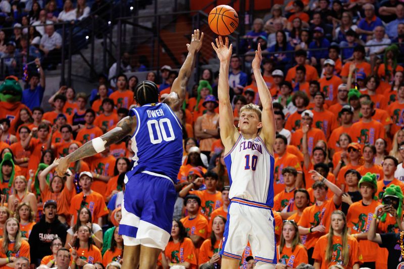Feb 14, 2026; Gainesville, Florida, USA; Florida Gators forward Thomas Haugh (10) shoots the ball over Kentucky Wildcats guard Otega Oweh (00) during the second half at Exactech Arena at the Stephen C. O'Connell Center. Mandatory Credit: Matt Pendleton-Imagn Images