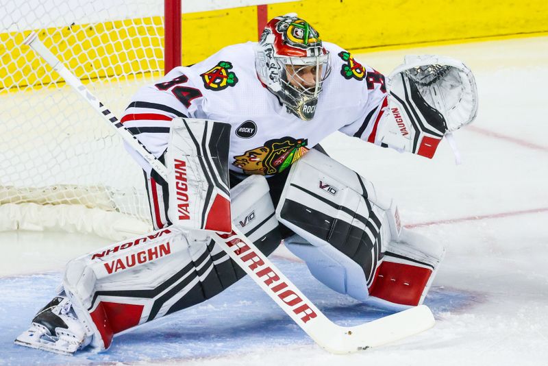 Jan 27, 2024; Calgary, Alberta, CAN; Chicago Blackhawks goaltender Petr Mrazek (34) guards his net against the Calgary Flames during the first period at Scotiabank Saddledome. Mandatory Credit: Sergei Belski-USA TODAY Sports