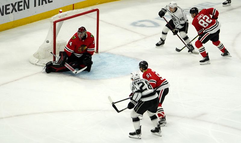 Jan 22, 2023; Chicago, Illinois, USA; Los Angeles Kings center Jaret Anderson-Dolan (28) scores a goal on Chicago Blackhawks goaltender Petr Mrazek (34) during the second period at United Center. Mandatory Credit: David Banks-USA TODAY Sports