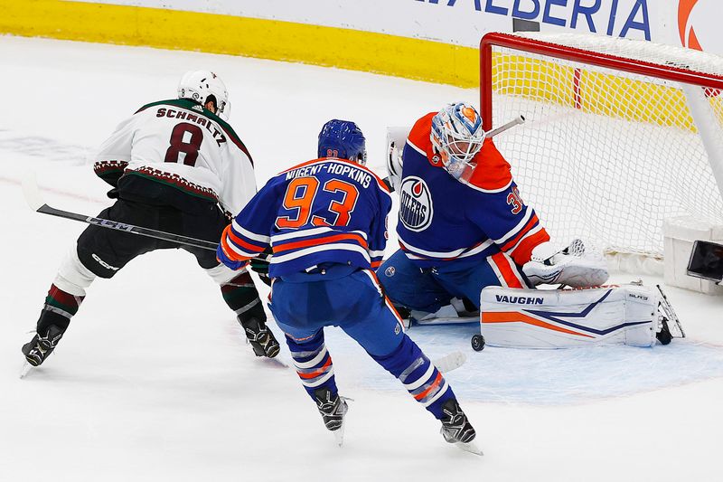 Apr 12, 2024; Edmonton, Alberta, CAN; Edmonton Oilers goaltender Calvin Pickard (30) makes a save on Arizona Coyotes forward Nick Schmaltz (8) during overtime at Rogers Place. Mandatory Credit: Perry Nelson-USA TODAY Sports