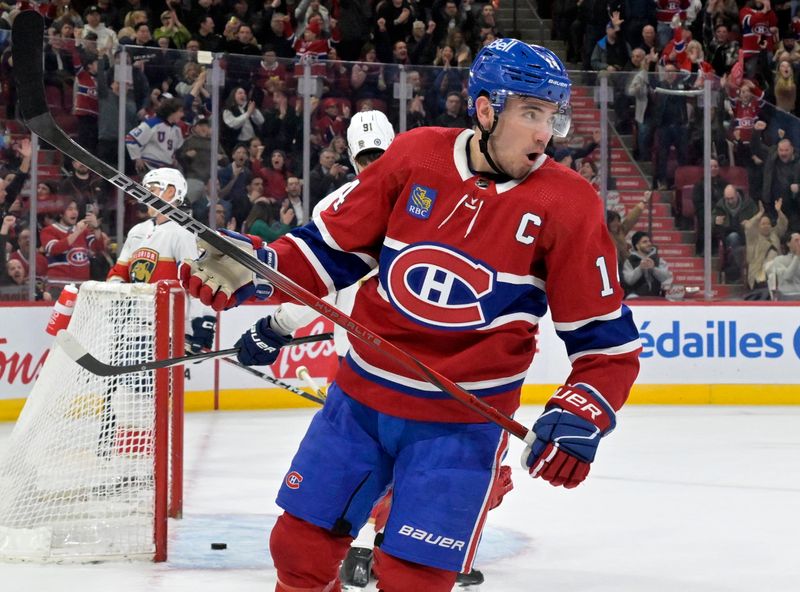 Apr 2, 2024; Montreal, Quebec, CAN; Montreal Canadiens forward Nick Suzuki (14) celebrates after scoring a goal against the Florida Panthers during the second period at the Bell Centre. Mandatory Credit: Eric Bolte-USA TODAY Sports