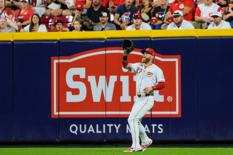 Jun 12, 2024; Cincinnati, Ohio, USA; Cincinnati Reds outfielder Jake Fraley (27) catches a fly out hit by Cleveland Guardians shortstop Brayan Rocchio (not pictured) in the eighth inning at Great American Ball Park. Mandatory Credit: Katie Stratman-USA TODAY Sports