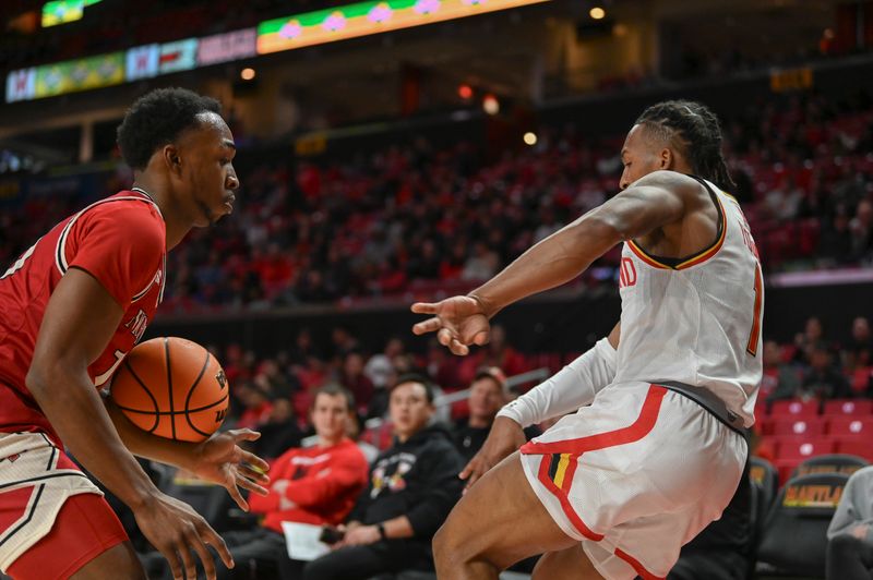 Dec 19, 2023; College Park, Maryland, USA;  Maryland Terrapins guard Jahmir Young (1) throws the ball off Nicholls State Colonels guard Byron Ireland (13) whole falling out of bounds during the second half at Xfinity Center. Mandatory Credit: Tommy Gilligan-USA TODAY Sports