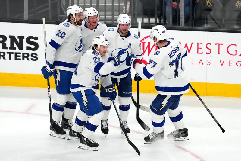 Mar 19, 2024; Las Vegas, Nevada, USA; Tampa Bay Lightning center Brayden Point (21) celebrates with team mates after scoring a goal against the Vegas Golden Knights during the third period at T-Mobile Arena. Mandatory Credit: Stephen R. Sylvanie-USA TODAY Sports