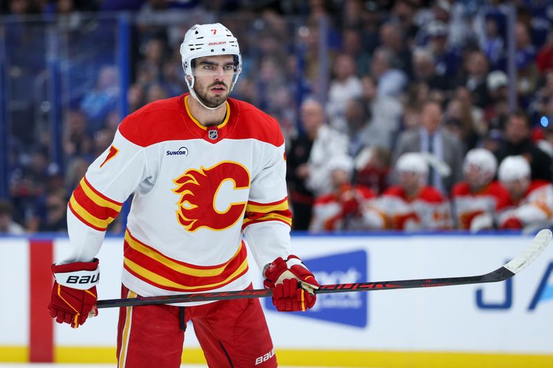 Nov 26, 2025; Tampa, Florida, USA; Calgary Flames defenseman Kevin Bahl (7) looks on against the Tampa Bay Lightning in the second period at Benchmark International Arena. Mandatory Credit: Nathan Ray Seebeck-Imagn Images