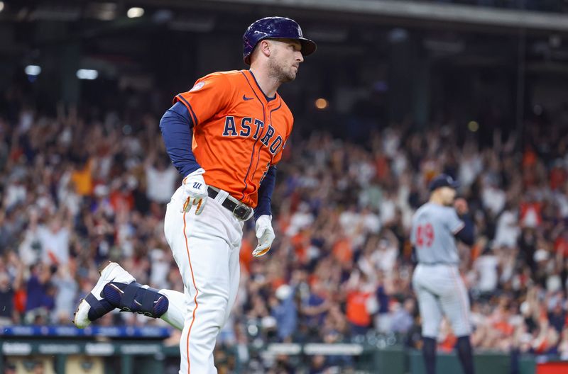 May 31, 2024; Houston, Texas, USA; Minnesota Twins starting pitcher Pablo Lopez (49) reacts and Houston Astros third baseman Alex Bregman (2) rounds the bases after hitting a home run during the fourth inning at Minute Maid Park. Mandatory Credit: Troy Taormina-USA TODAY Sports