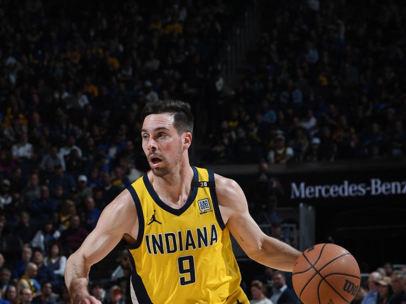 SAN FRANCISCO, CA - MARCH 22: T.J. McConnell #9 of the Indiana Pacers dribbles the ball during the game against the Golden State Warriors on March 22, 2024 at Chase Center in San Francisco, California. NOTE TO USER: User expressly acknowledges and agrees that, by downloading and or using this photograph, user is consenting to the terms and conditions of Getty Images License Agreement. Mandatory Copyright Notice: Copyright 2024 NBAE (Photo by Noah Graham/NBAE via Getty Images)