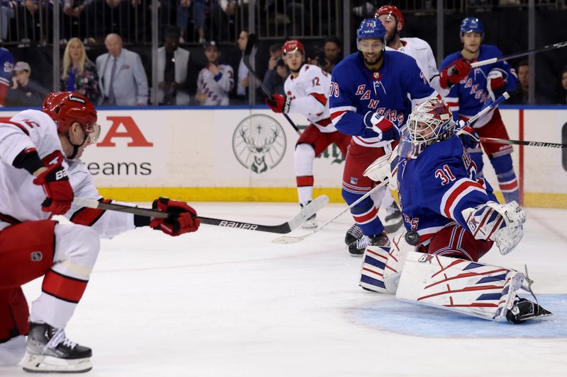 May 13, 2024; New York, New York, USA; Carolina Hurricanes center Evgeny Kuznetsov (92) scores a goal against New York Rangers goaltender Igor Shesterkin (31) during the third period of game five of the second round of the 2024 Stanley Cup Playoffs at Madison Square Garden. Mandatory Credit: Brad Penner-USA TODAY Sports