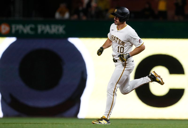 Apr 8, 2024; Pittsburgh, Pennsylvania, USA;  Pittsburgh Pirates left fielder Bryan Reynolds (10) circles the bases on a solo home run against the Detroit Tigers during the sixth inning at PNC Park. Mandatory Credit: Charles LeClaire-USA TODAY Sports