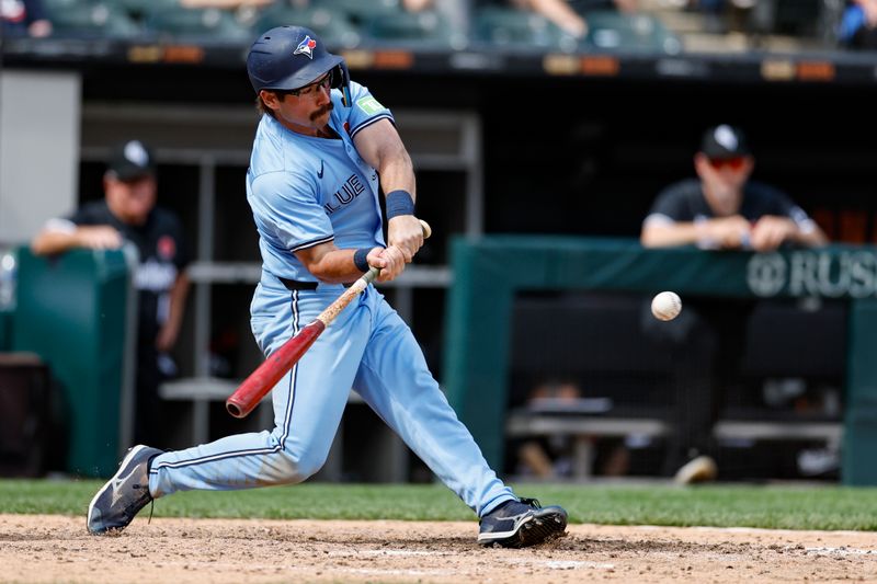 May 27, 2024; Chicago, Illinois, USA; Toronto Blue Jays outfielder Davis Schneider (36) hits a two-run home run against the Chicago White Sox during the ninth inning at Guaranteed Rate Field. Mandatory Credit: Kamil Krzaczynski-USA TODAY Sports