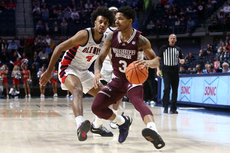 Feb 18, 2023; Oxford, Mississippi, USA; Mississippi State Bulldogs guard Shakeel Moore (3) dribbles as Mississippi Rebels forward Jaemyn Brakefield (4) defends during the first half at The Sandy and John Black Pavilion at Ole Miss. Mandatory Credit: Petre Thomas-USA TODAY Sports