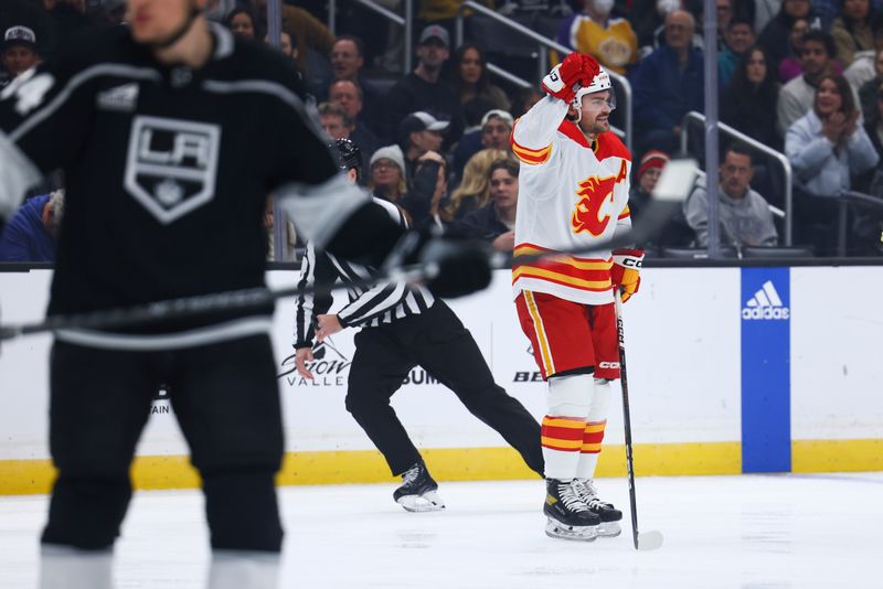 Dec 23, 2023; Los Angeles, California, USA; Calgary Flames defenseman Rasmus Andersson (4) celebrates after scoring a gaol during the first period against the Los Angeles Kings at Crypto.com Arena. Mandatory Credit: Jessica Alcheh-USA TODAY Sports