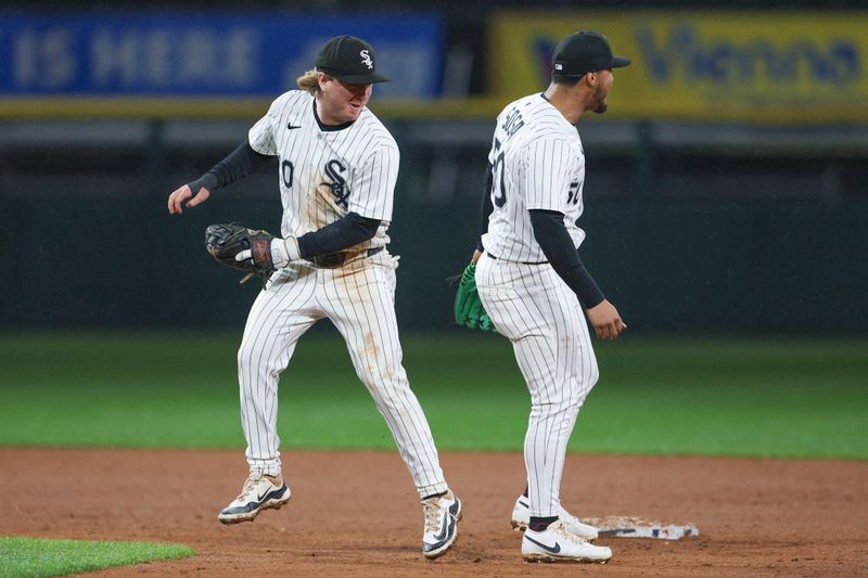 May 20, 2025; Chicago, Illinois, USA; Chicago White Sox shortstop Chase Meidroth (10) celebrates with second baseman Lenyn Sosa (50) team's win against the Seattle Mariners at Rate Field. Mandatory Credit: Kamil Krzaczynski-Imagn Images