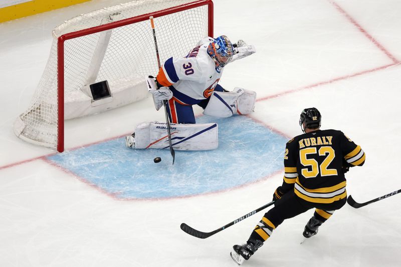Oct 28, 2025; Boston, Massachusetts, USA; New York Islanders goaltender Ilya Sorokin (30) makes a save as Boston Bruins center Sean Kuraly (52) looks for the rebound during the first period at TD Garden. Mandatory Credit: Winslow Townson-Imagn Images