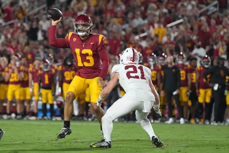 Sep 9, 2023; Los Angeles, California, USA; Southern California Trojans quarterback Caleb Williams (13) throws the ball against Stanford Cardinal safety Scotty Edwards (21) in the first half at United Airlines Field at Los Angeles Memorial Coliseum. Mandatory Credit: Kirby Lee-USA TODAY Sports