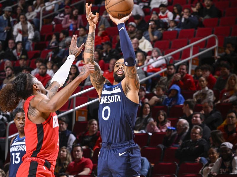 HOUSTON, TX - JANUARY 23:   D'Angelo Russell #0 of the Minnesota Timberwolves shoots a three point basket during the game against the  Houston Rockets on January 23, 2023 at the Toyota Center in Houston, Texas. NOTE TO USER: User expressly acknowledges and agrees that, by downloading and or using this photograph, User is consenting to the terms and conditions of the Getty Images License Agreement. Mandatory Copyright Notice: Copyright 2023 NBAE (Photo by Logan Riely/NBAE via Getty Images)