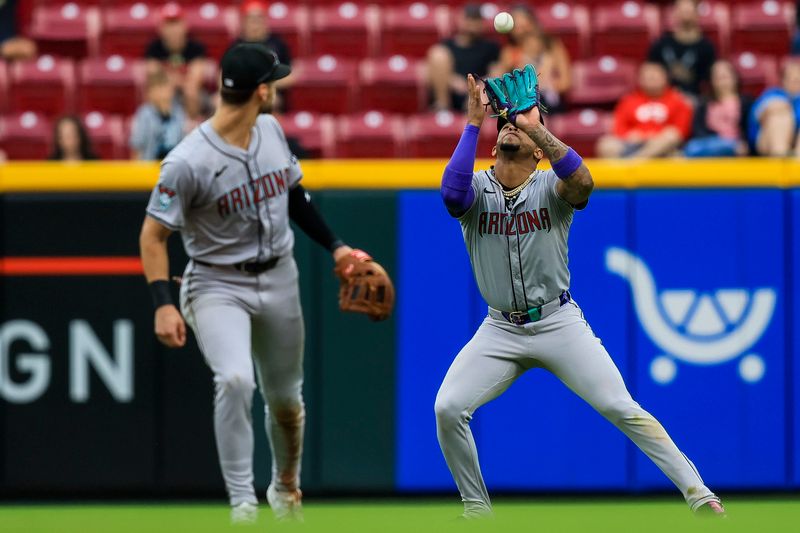 May 9, 2024; Cincinnati, Ohio, USA; Arizona Diamondbacks second baseman Ketel Marte (4) catches a pop up hit by Cincinnati Reds designated hitter Mike Ford (not pictured) in the sixth inning at Great American Ball Park. Mandatory Credit: Katie Stratman-USA TODAY Sports