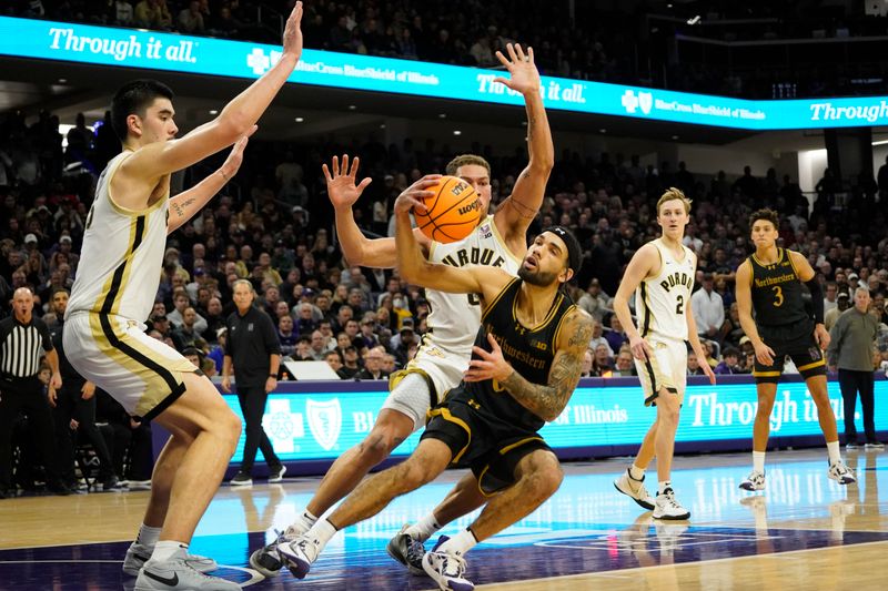 Dec 1, 2023; Evanston, Illinois, USA; Purdue Boilermakers center Zach Edey (15) defends Northwestern Wildcats guard Boo Buie (0) during the second half at Welsh-Ryan Arena. Mandatory Credit: David Banks-USA TODAY Sports