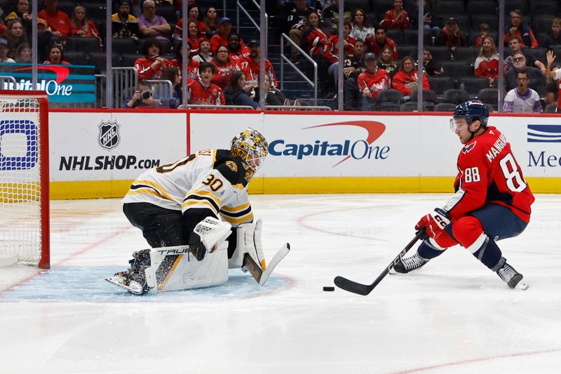 Oct 5, 2024; Washington, District of Columbia, USA; Washington Capitals left wing Andrew Mangiapane (88) skates in on Boston Bruins goaltender Brandon Bussi (30) in the third period at Capital One Arena. Mandatory Credit: Geoff Burke-Imagn Images