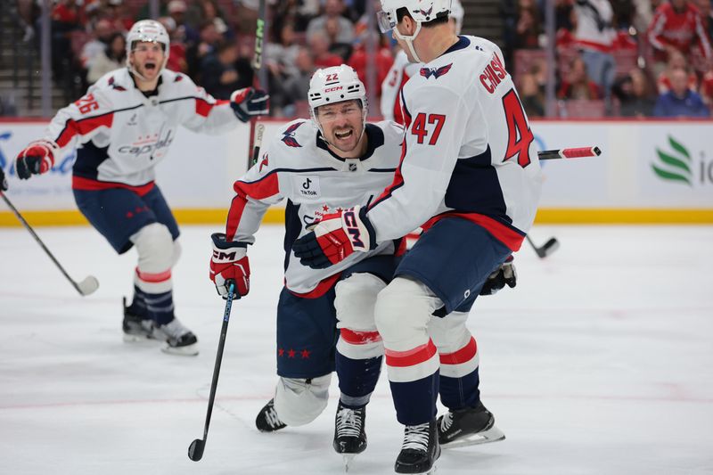 Nov 13, 2025; Sunrise, Florida, USA; Washington Capitals right wing Brandon Duhaime (22) celebrates with defenseman Declan Chisholm (47) after scoring during the first period at Amerant Bank Arena. Mandatory Credit: Sam Navarro-Imagn Images