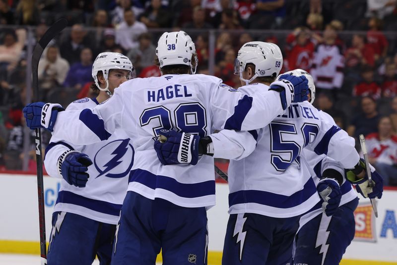 Oct 22, 2024; Newark, New Jersey, USA; Tampa Bay Lightning center Jake Guentzel (59) celebrates his goal against the New Jersey Devils during the third period at Prudential Center. Mandatory Credit: Ed Mulholland-Imagn Images