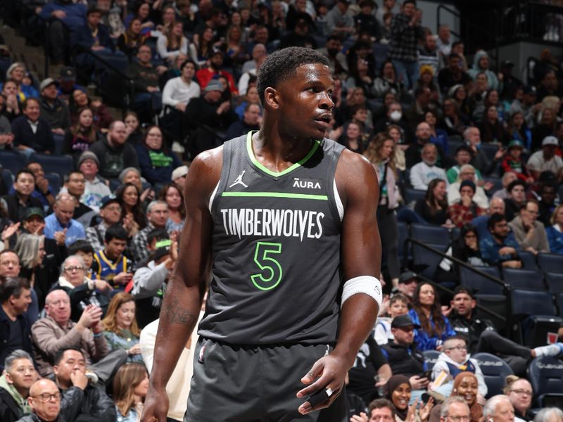 MINNEAPOLIS, MN -  MARCH 24: Anthony Edwards #5 of the Minnesota Timberwolves looks on during the game against the Golden State Warriors on March 24, 2024 at Target Center in Minneapolis, Minnesota. NOTE TO USER: User expressly acknowledges and agrees that, by downloading and or using this Photograph, user is consenting to the terms and conditions of the Getty Images License Agreement. Mandatory Copyright Notice: Copyright 2024 NBAE (Photo by David Sherman/NBAE via Getty Images)