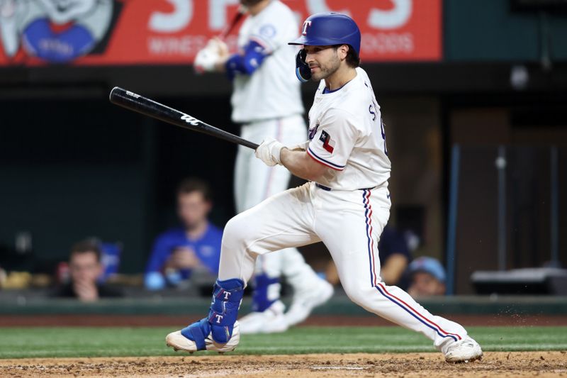 Apr 29, 2025; Arlington, Texas, USA; Texas Rangers shortstop Josh Smith (8) singles in a run during the eighth inning against the Oakland Athletics at Globe Life Field. Mandatory Credit: Tim Heitman-Imagn Images