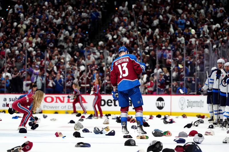 Apr 28, 2024; Denver, Colorado, USA; Colorado Avalanche right wing Valeri Nichushkin (13) celebrates hat trick during the third period against the Winnipeg Jets in game four of the first round of the 2024 Stanley Cup Playoffs at Ball Arena. Mandatory Credit: Ron Chenoy-USA TODAY Sports