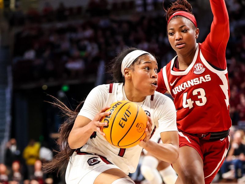 Jan 22, 2023; Columbia, South Carolina, USA; South Carolina Gamecocks guard Zia Cooke (1) drives around Arkansas Razorbacks guard Makayla Daniels (43) in the second half at Colonial Life Arena. Mandatory Credit: Jeff Blake-USA TODAY Sports