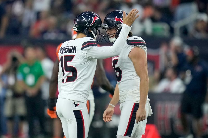 Houston Texans kicker Ka'imi Fairbairn (15) is congratulated by Tommy Townsend (6) after kicking a 56-yard field goal during the first half of an NFL football game against the Chicago Bears Sunday, Sept. 15, 2024, in Houston. (AP Photo/Eric Christian Smith)