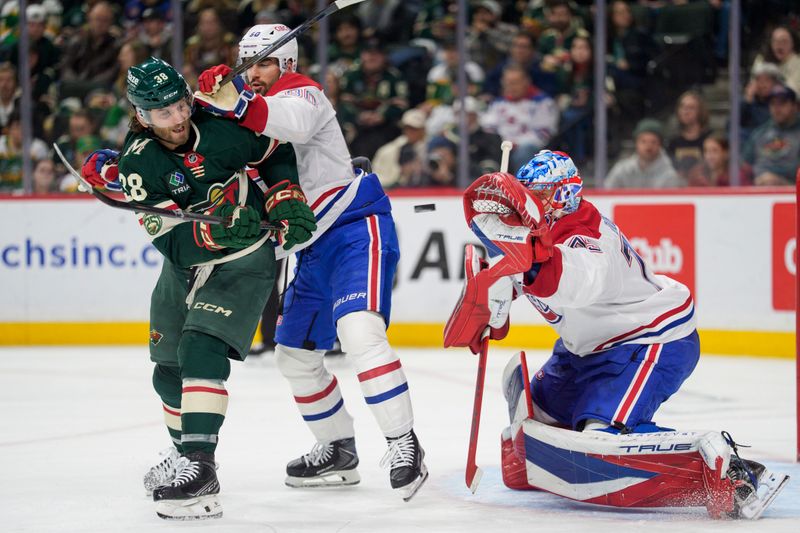 Feb 2, 2026; Saint Paul, Minnesota, USA; Minnesota Wild right wing Ryan Hartman (38) is hit by Montreal Canadiens center Joe Veleno (90) while trying to deflect a shot in the second period at Grand Casino Arena. Mandatory Credit: Matt Blewett-Imagn Images