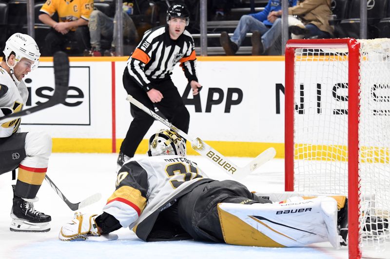 Mar 26, 2024; Nashville, Tennessee, USA; Vegas Golden Knights goaltender Jiri Patera (30) loses his stick as he makes a save during the first period against the Nashville Predators at Bridgestone Arena. Mandatory Credit: Christopher Hanewinckel-USA TODAY Sports