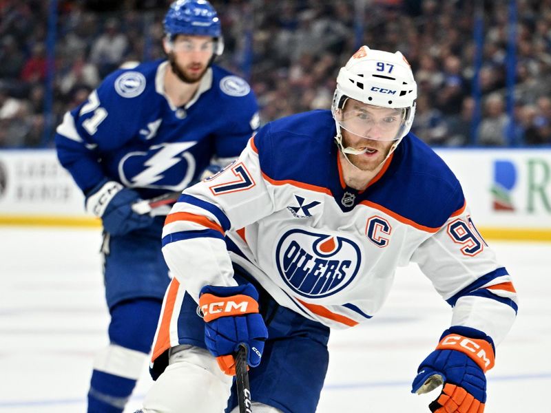 Feb 25, 2025; Tampa, Florida, USA;  Edmonton Oilers center Connor McDavid (97) controls  the puck  in the second period against the Tampa Bay Lightning  at Amalie Arena. Mandatory Credit: Jonathan Dyer-Imagn Images