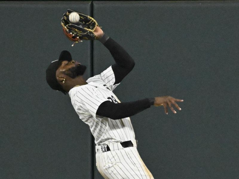 Jul 27, 2024; Chicago, Illinois, USA;  Chicago White Sox outfielder Luis Robert Jr. (88) catches a fly ball hit by Seattle Mariners third base Jason Vosler (35) during the eighth inning at Guaranteed Rate Field. Mandatory Credit: Matt Marton-USA TODAY Sports