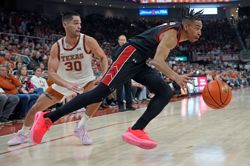 Jan 6, 2024; Austin, Texas, USA; Texas Tech Red Raiders guard Chance McMillian (0) drives to the basket past Texas Longhorns forward Brock Cunningham (30) during the second half at Moody Center. Mandatory Credit: Scott Wachter-USA TODAY Sports