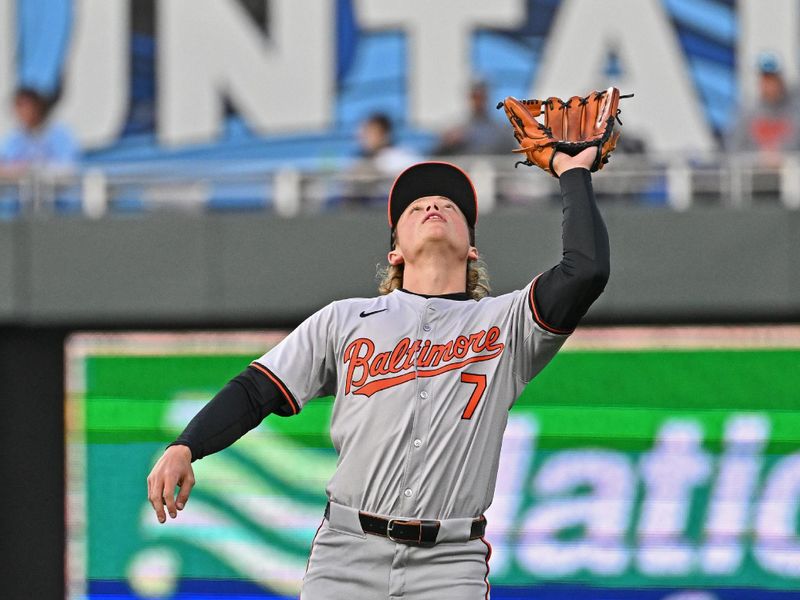 Apr 19, 2024; Kansas City, Missouri, USA; Baltimore Orioles second baseman Jackson Holliday (7) catches a pop fly for an out in the third inning against the Kansas City Royals at Kauffman Stadium. Mandatory Credit: Peter Aiken-USA TODAY Sports