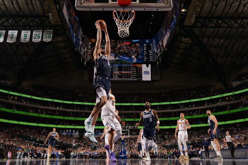 DALLAS, TX - MARCH 17: Dereck Lively II #2 of the Dallas Mavericks drives to the basket during the game against the Denver Nuggets on March 17, 2024 at the American Airlines Center in Dallas, Texas. NOTE TO USER: User expressly acknowledges and agrees that, by downloading and or using this photograph, User is consenting to the terms and conditions of the Getty Images License Agreement. Mandatory Copyright Notice: Copyright 2024 NBAE (Photo by Glenn James/NBAE via Getty Images)