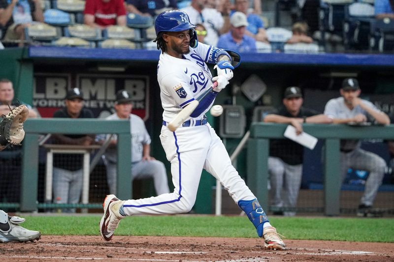 Sep 5, 2023; Kansas City, Missouri, USA; Kansas City Royals third baseman Maikel Garcia (11) hits a triple against the Chicago White Sox in the third inning at Kauffman Stadium. Mandatory Credit: Denny Medley-USA TODAY Sports