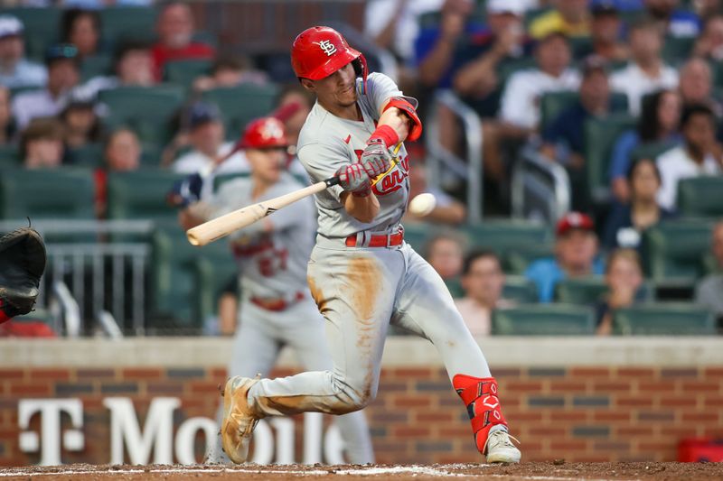 Sep 7, 2023; Atlanta, Georgia, USA; St. Louis Cardinals shortstop Tommy Edman (19) hits a two-run single against the Atlanta Braves in the second inning at Truist Park. Mandatory Credit: Brett Davis-USA TODAY Sports