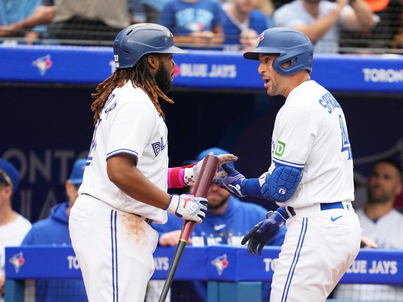 Sep 9, 2023; Toronto, Ontario, CAN; Toronto Blue Jays right fielder George Springer (4) celebrates hitting a home run with teammate first baseman Vladimir Guerrero Jr. (27) against the Kansas City Royals during the fourth inning at Rogers Centre. Mandatory Credit: Nick Turchiaro-USA TODAY Sports