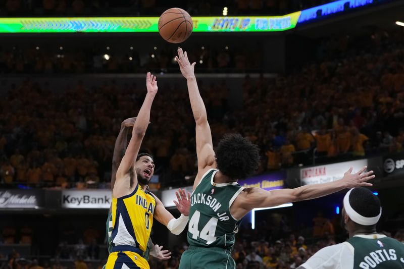 INDIANAPOLIS, INDIANA - APRIL 26: Tyrese Haliburton #0 of the Indiana Pacers attempts a shot while being fouled by Patrick Beverley #21 of the Milwaukee Bucks in overtime during game three of the Eastern Conference First Round Playoffs at Gainbridge Fieldhouse on April 26, 2024 in Indianapolis, Indiana. NOTE TO USER: User expressly acknowledges and agrees that, by downloading and or using this photograph, User is consenting to the terms and conditions of the Getty Images License Agreement. (Photo by Dylan Buell/Getty Images)