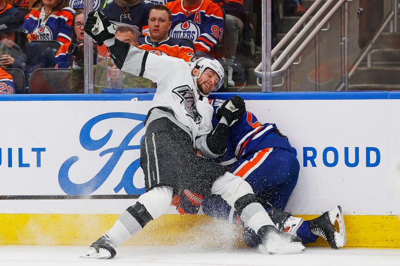 Apr 22, 2024; Edmonton, Alberta, CAN; Los Angeles Kings forward Adrian Kempe (9) checks Edmonton Oilers defensemen Darnell Nurse (25) during the second period in game one of the first round of the 2024 Stanley Cup Playoffs at Rogers Place. Mandatory Credit: Perry Nelson-USA TODAY Sports